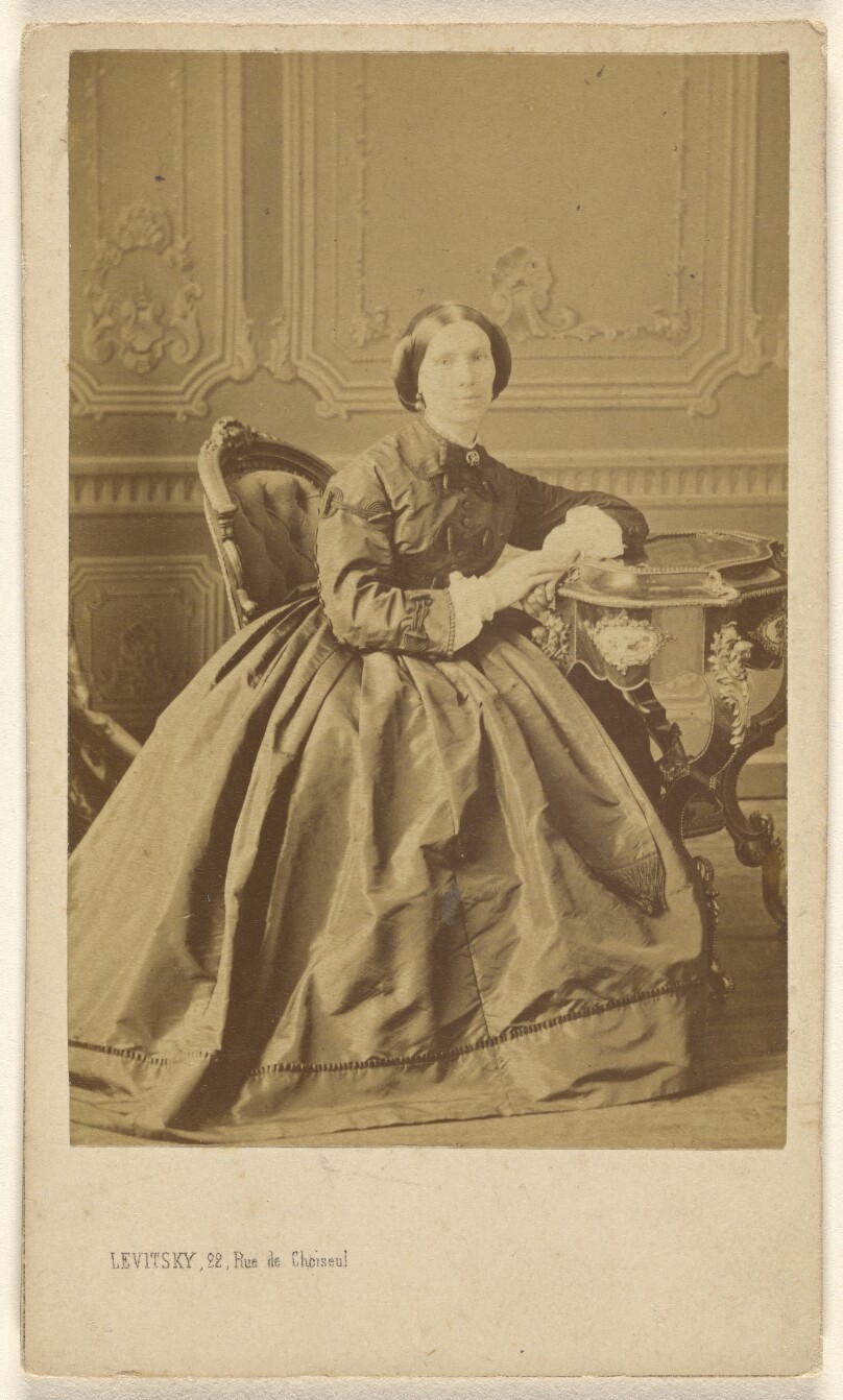 [Unidentified woman, seated]