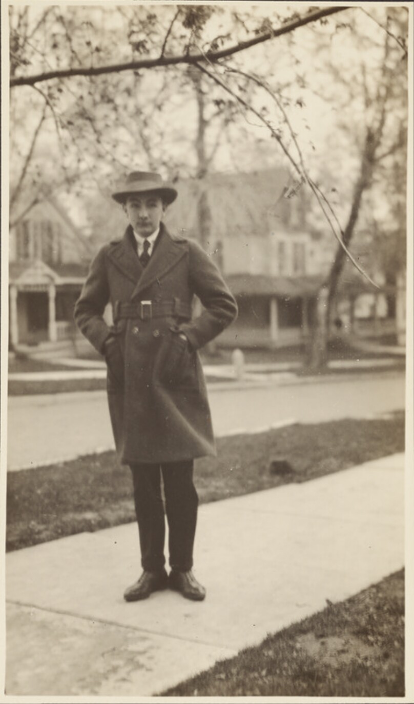 [Man in coat and hat]
