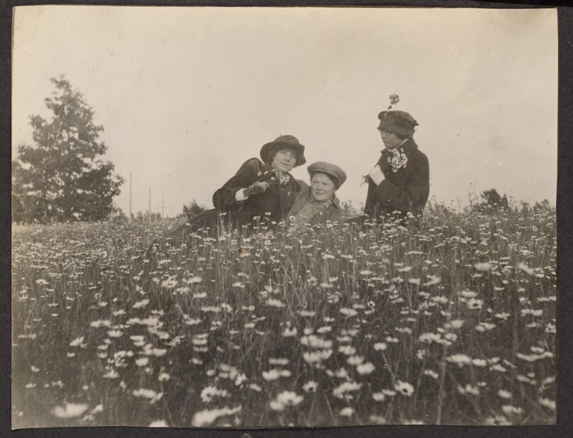 [Three women in a field]