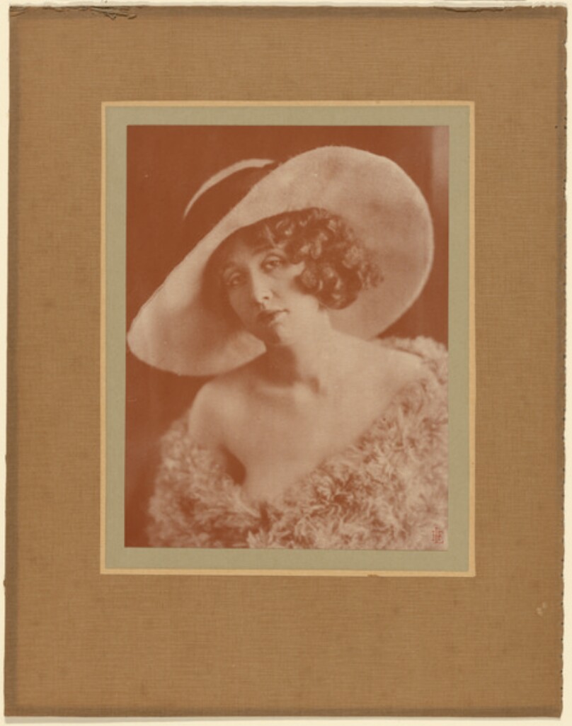 [Portrait of woman in hat]