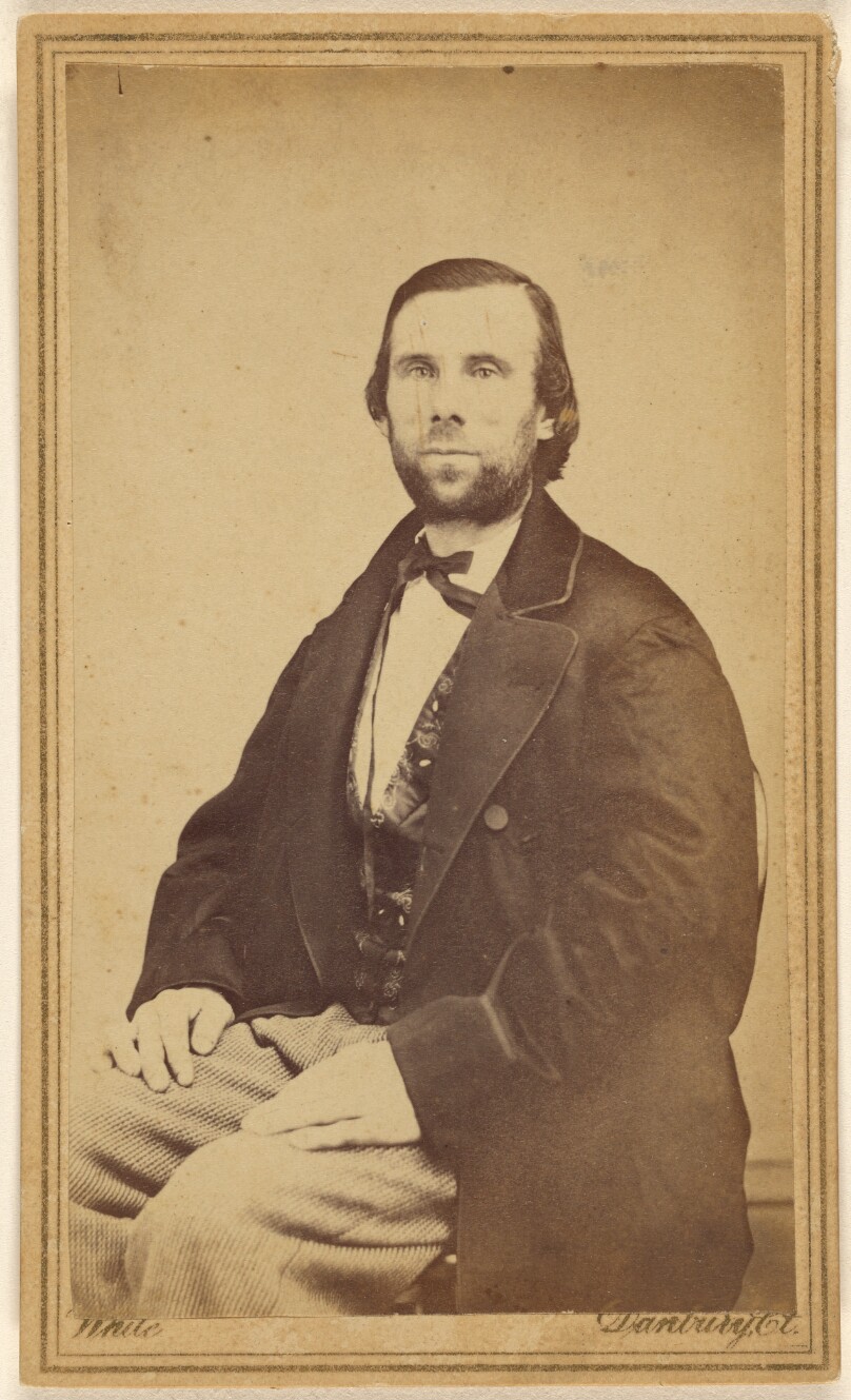 [Unidentified bearded man, seated]