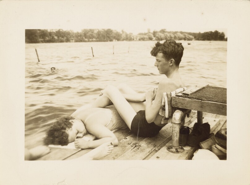 [Young man and woman on a dock]