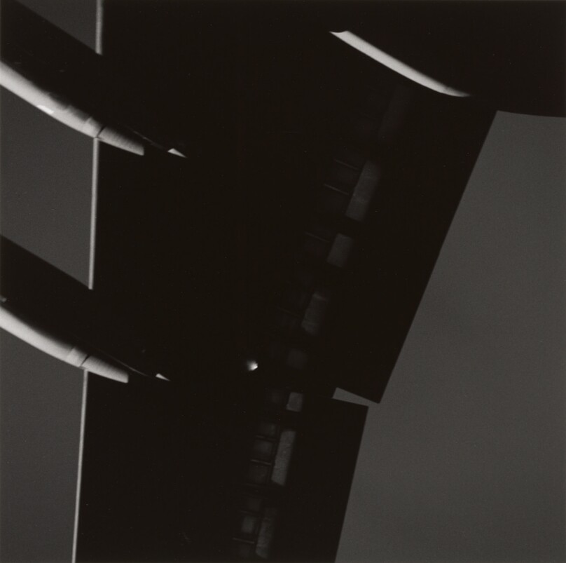 Untitled [wing of airplane from below]
