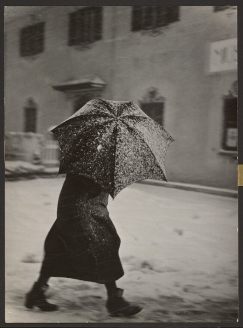 [Figure with umbrella in snow]