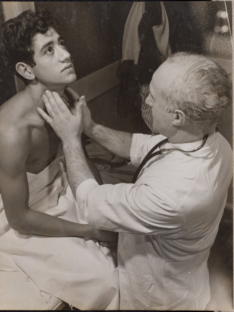 [Doctor checks a patient's lymph nodes]