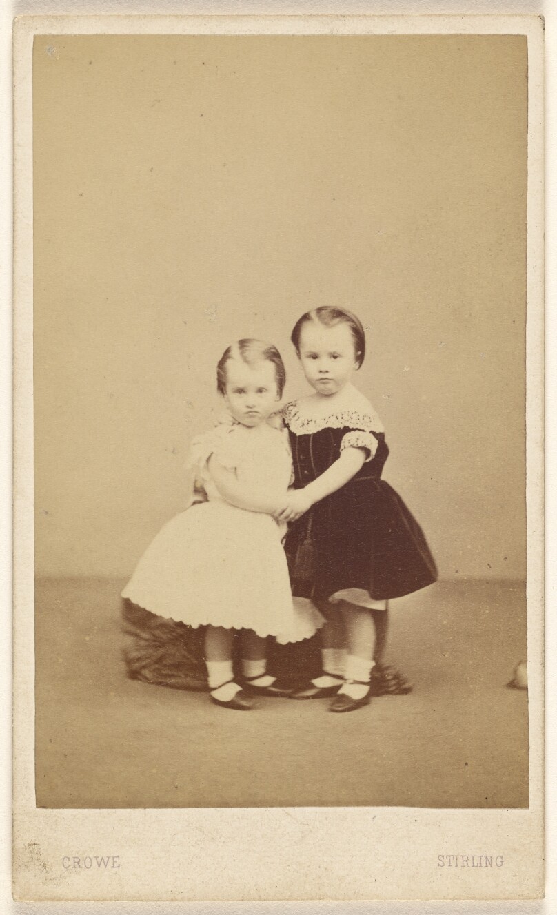[Two little girls embracing]