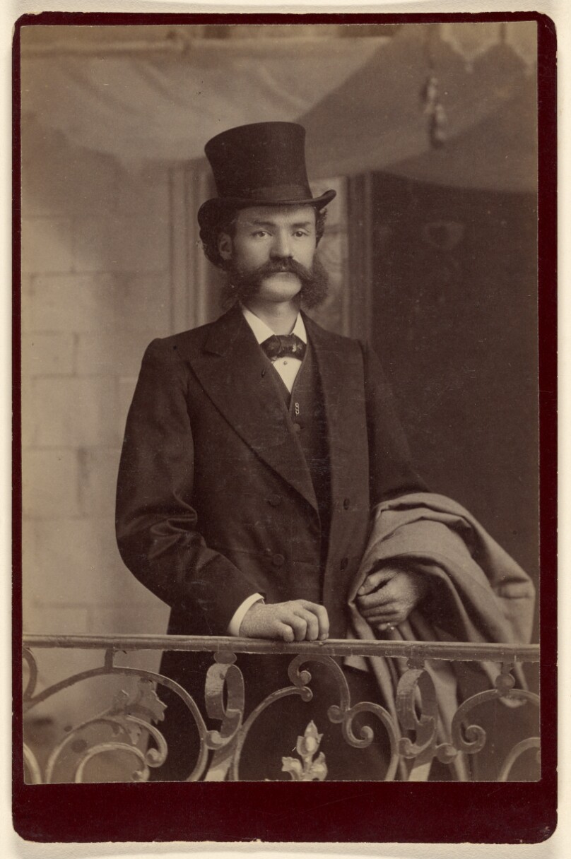 [Unidentified man with moustache and muttonchops wearing fancy clothes and a top hat]