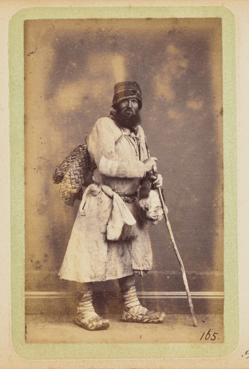[Bearded man with walking stick]
