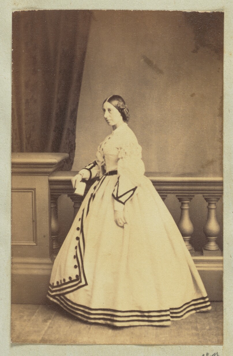 [Portrait of woman in dress with black accents]