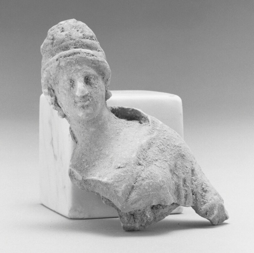 Fragment of a Draped Female Figurine