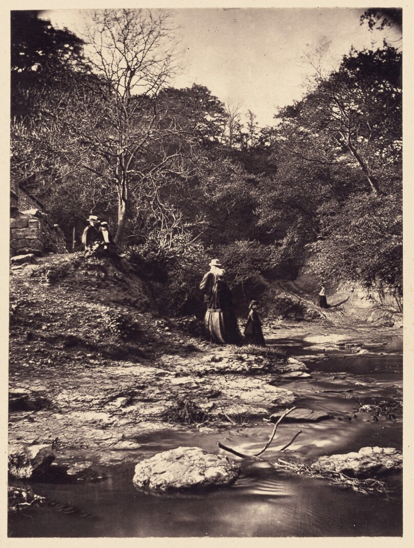 [Couple and child by stream]