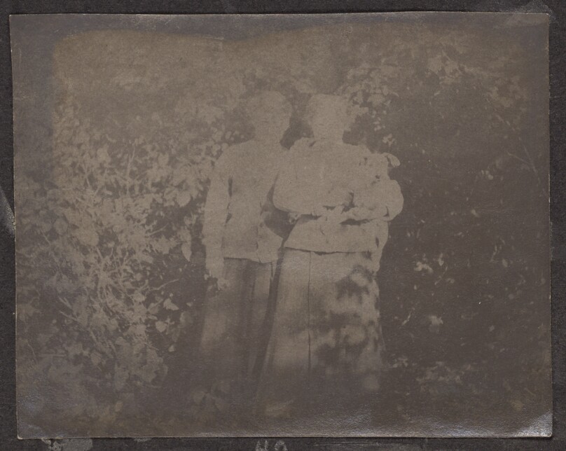 [Two women and a dog]