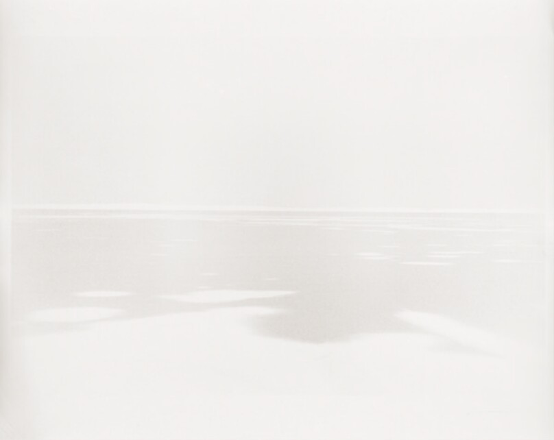 [Muted Body of Water with Washed Out Sky]