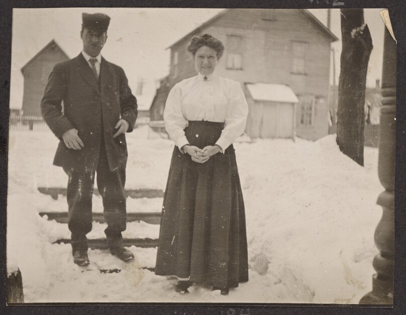 [Man and woman standing in the snow]