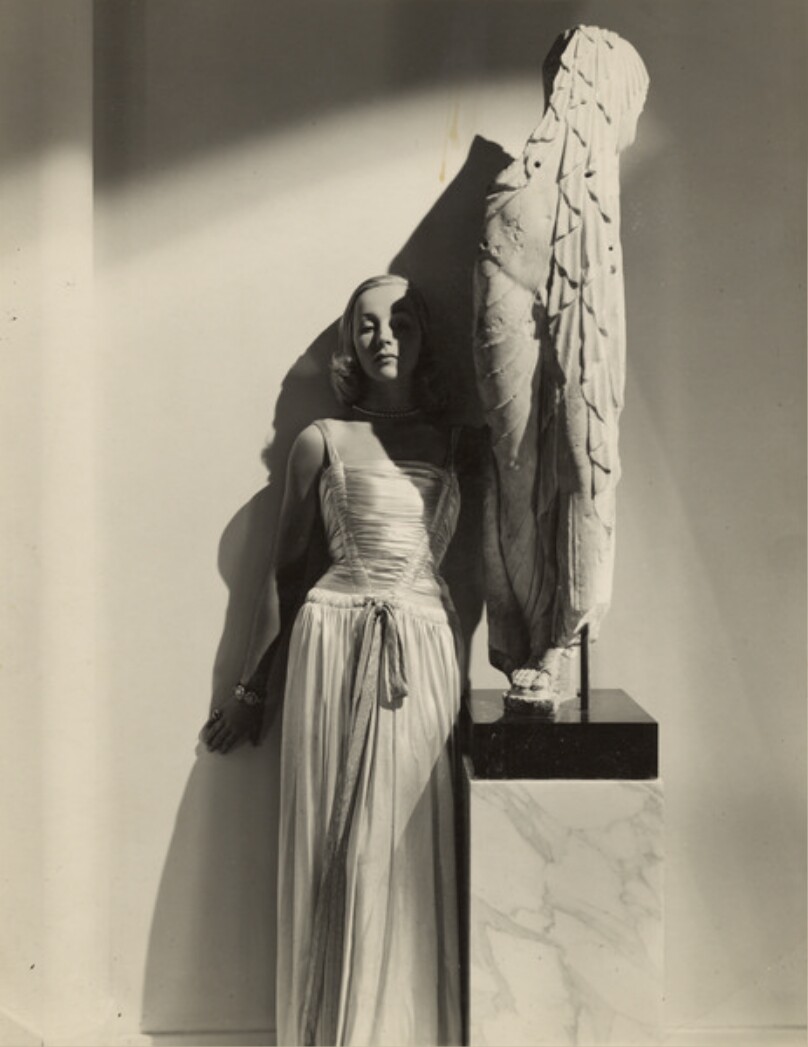 Model Posed with a Statue, New York