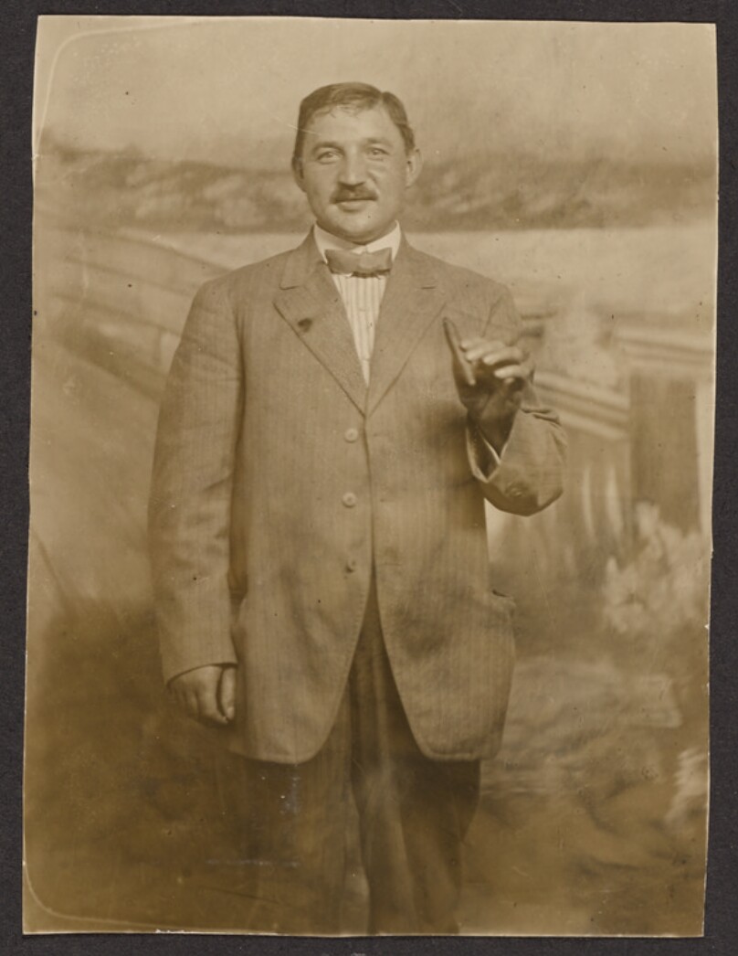 [Man smoking a cigar]