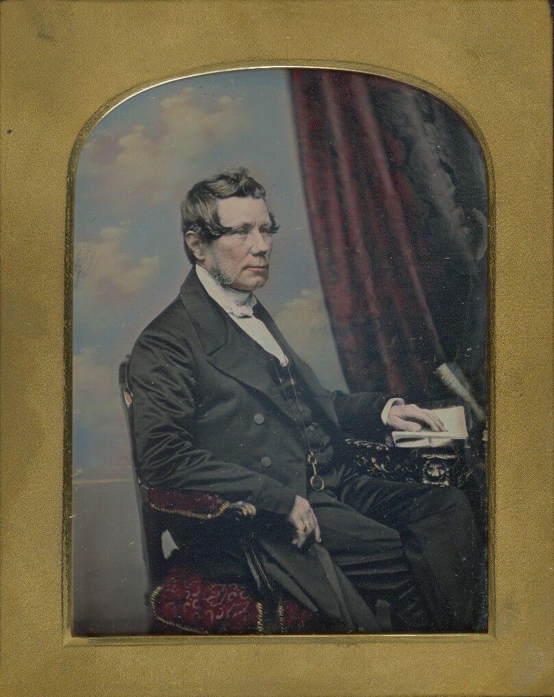 [Portrait of a Seated Man with Graying Muttonchop Whiskers]