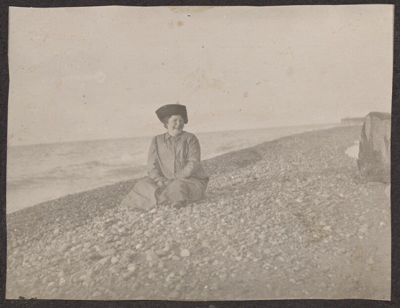 [Woman sitting on a beach]