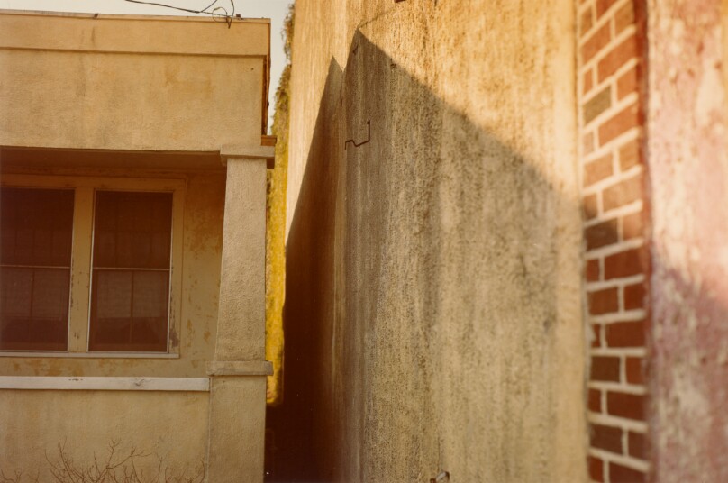 [Close up view of stucco and brick building exterior, U.S.A.]