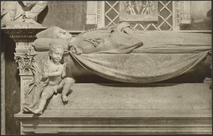 [Recumbent effigy of the Cardinal, by Antonio Rossellino, (before removal of drapery from Putto)]