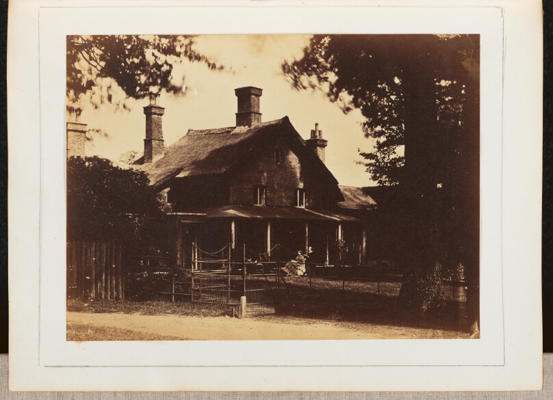 [View of a Man and a Woman Sitting on a Porch]