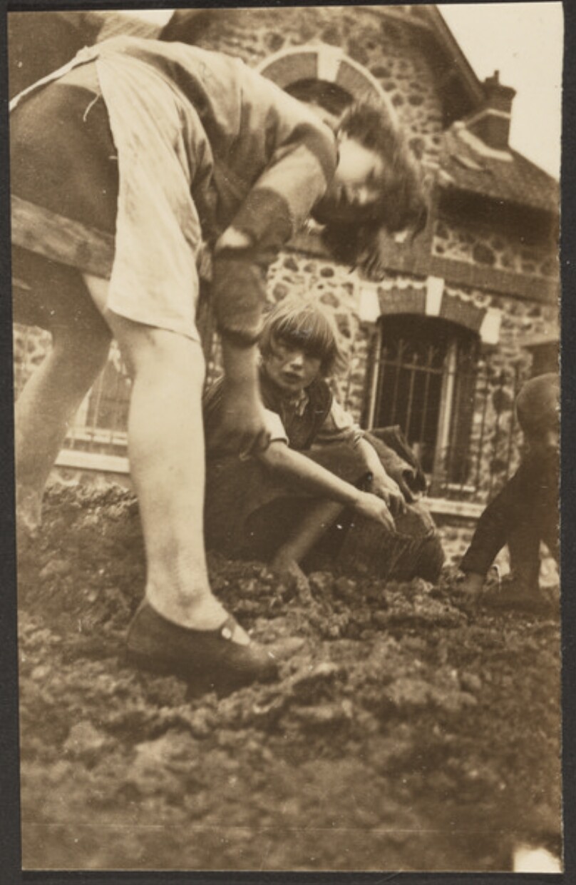 [Two Girls and a Boy Digging in Earth]