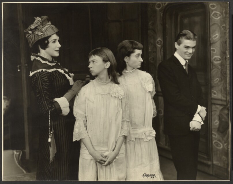 [Still from theatrical production]