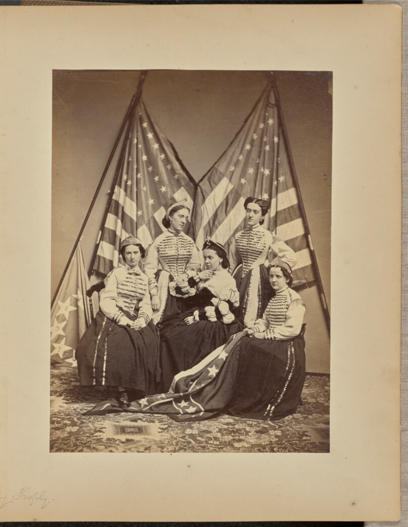 [Group of women in front of American flags]