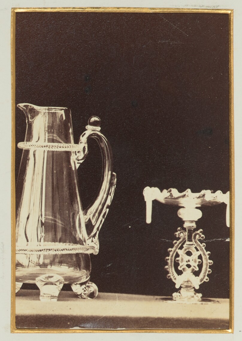 [Silver pitcher and ornate serving dish]