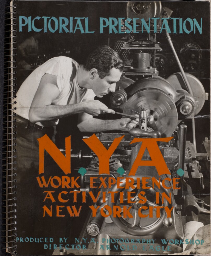 [Man in a white shirt works with machinery]