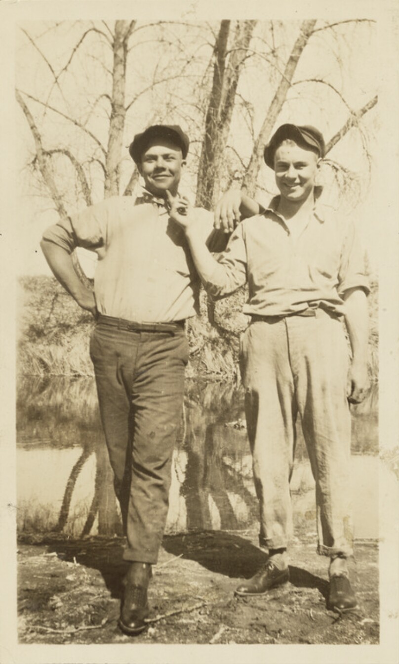 [Two men in caps]
