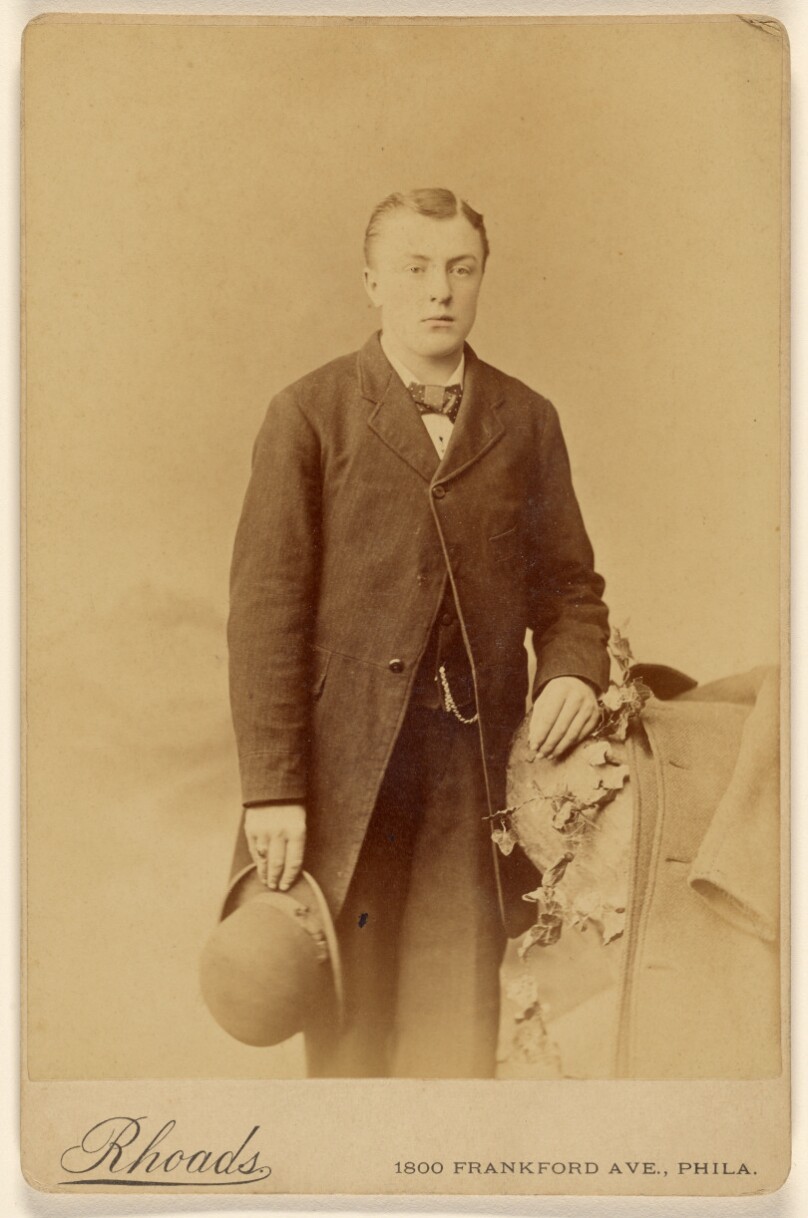 [Man holding derby, standing]