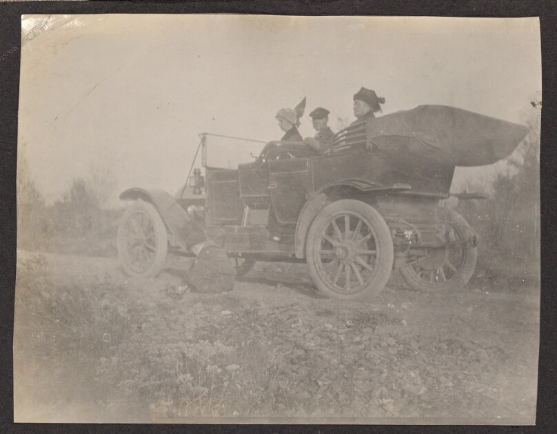 [Group sitting in a car]