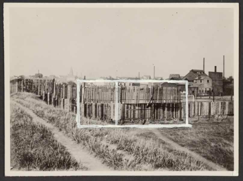 [Wooden Fence at Outskirts of City]