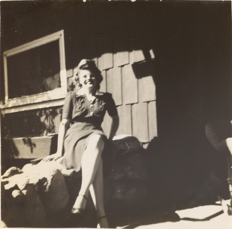 [Woman on stone wall]
