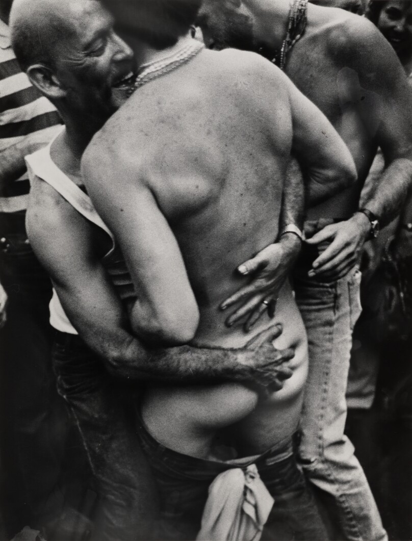 [Men embracing]