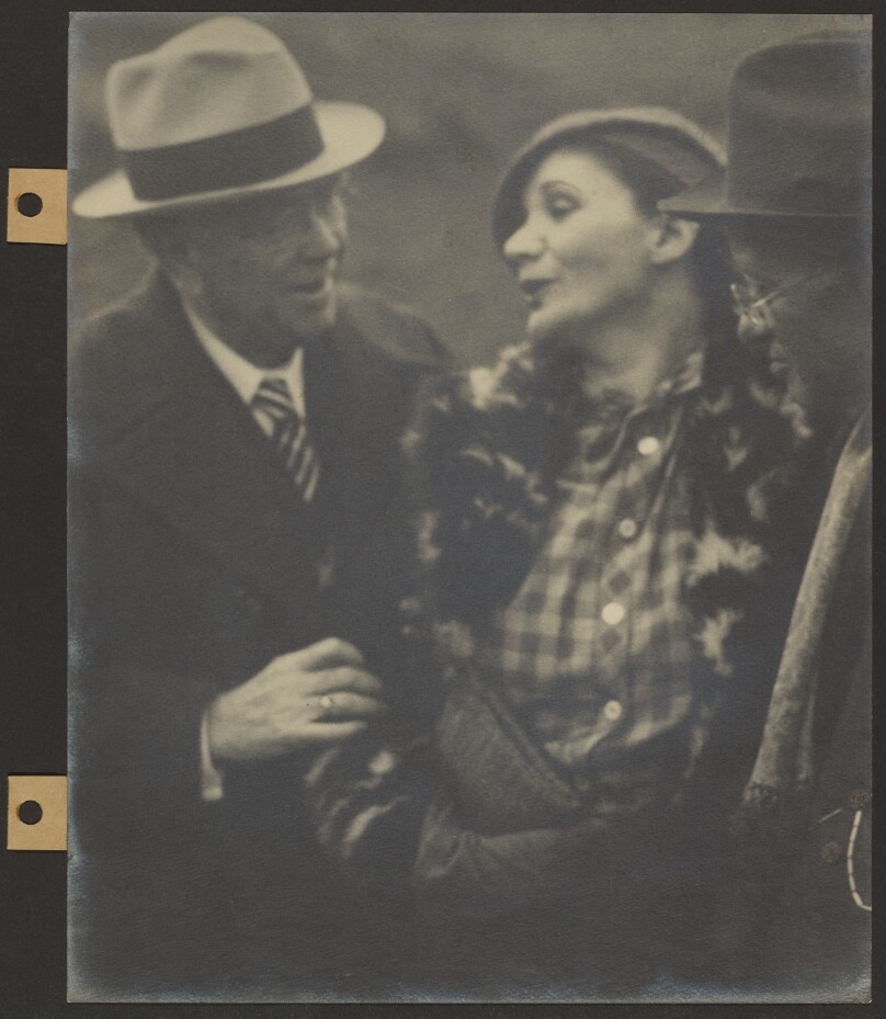 [Two Men and a Woman Talking]