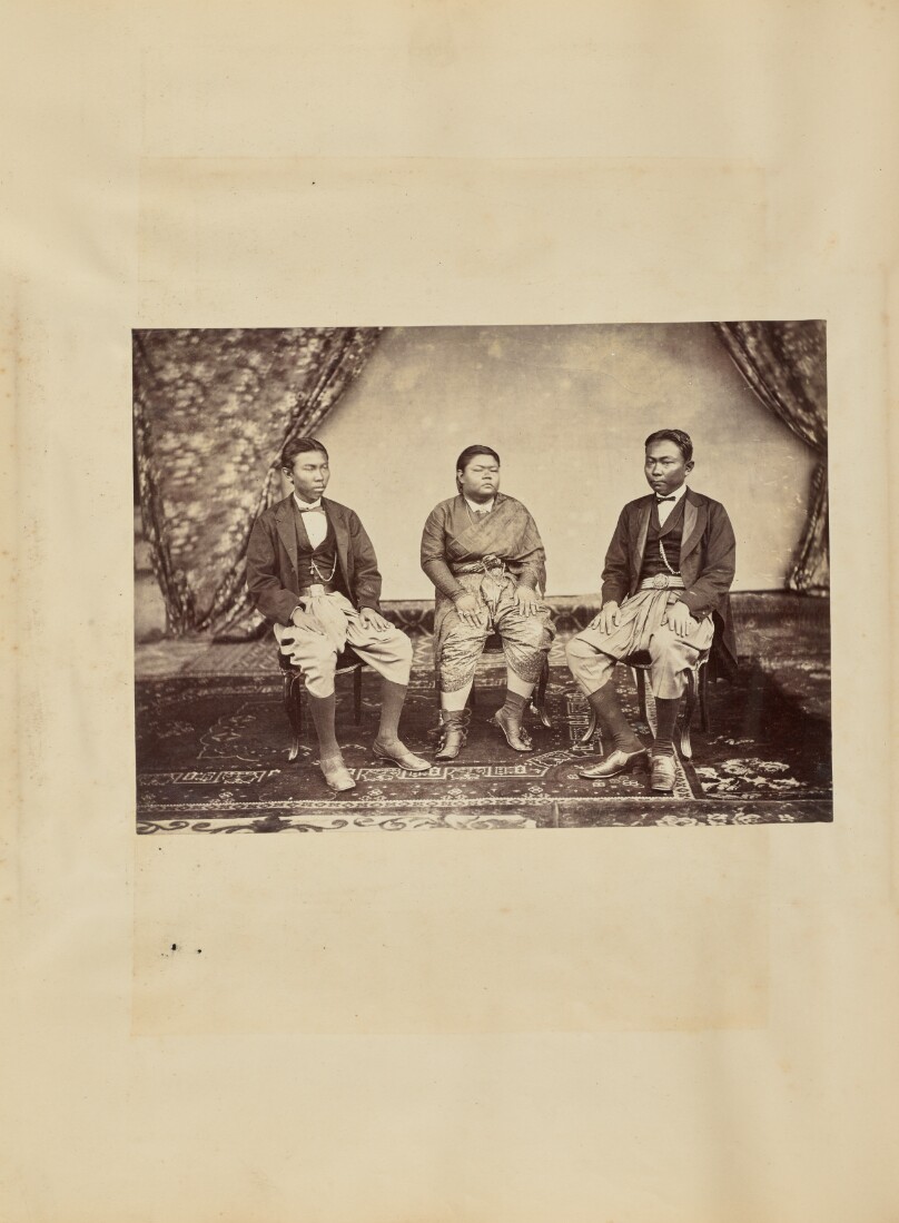 [Studio portrait of three young men]