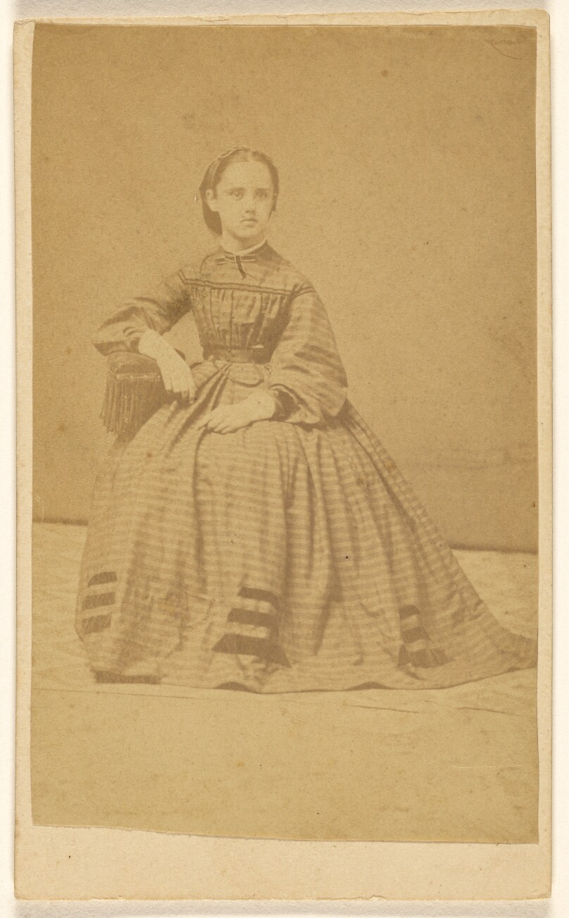 [Unidentified young woman, seated]