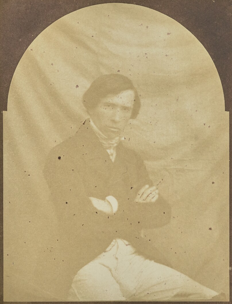 [Portrait of a Seated Man with Arms Crossed]