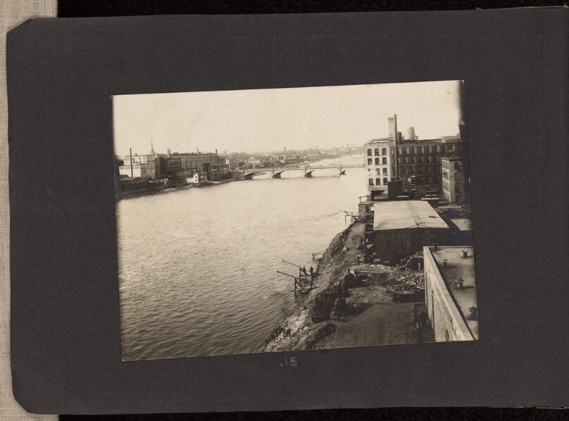 [View of factory buildings along the shores of the Grand River]