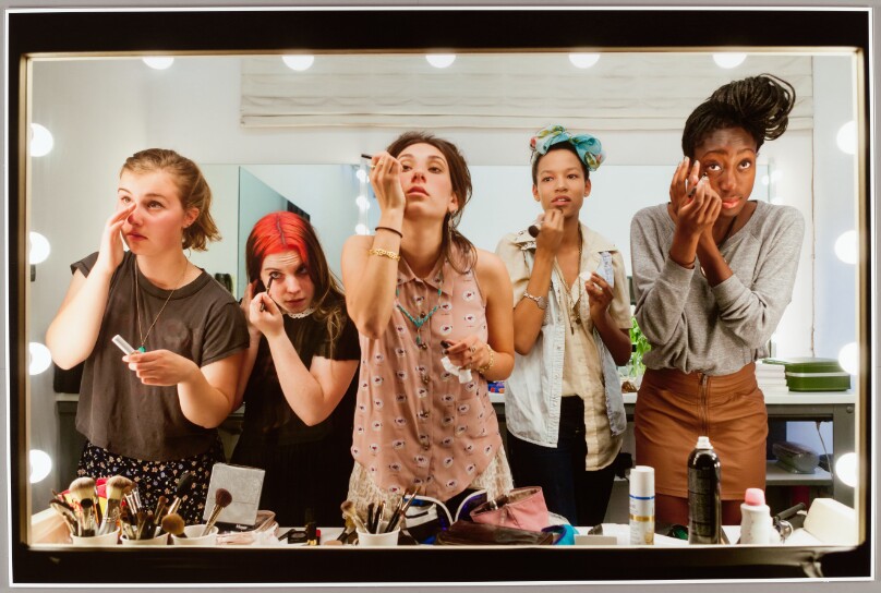 High school seniors (from left) Lili, 17, Nicole, 18, Lauren, 18, Luna, 18, and Sam, 17, put on their makeup in front of a two-way mirror for Lauren Greenfield’s Beauty CULTure documentary, Los Angeles, 2011.