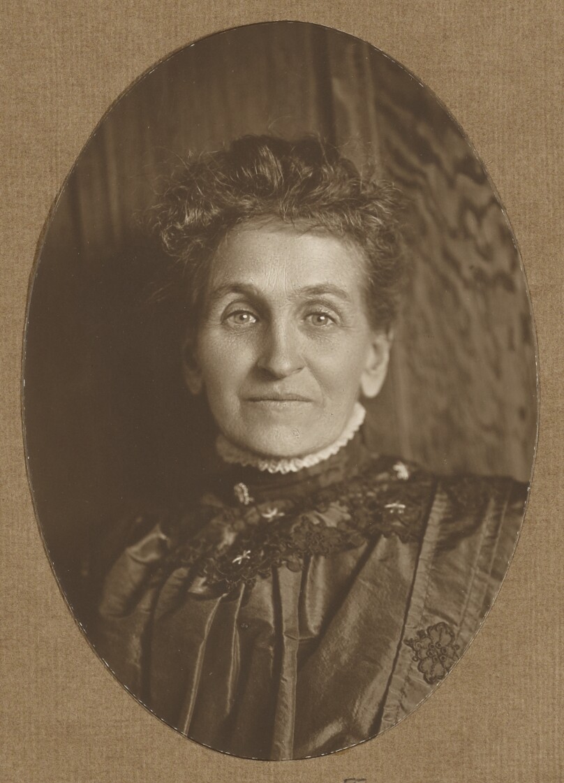 [Portrait of a woman wearing a high collar]