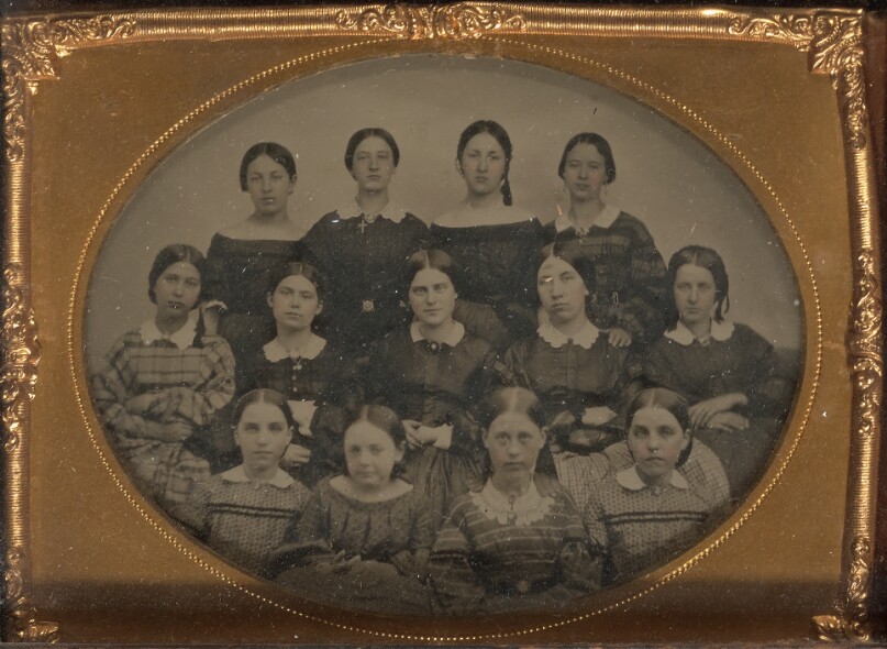 [Group portrait of thirteen young women]