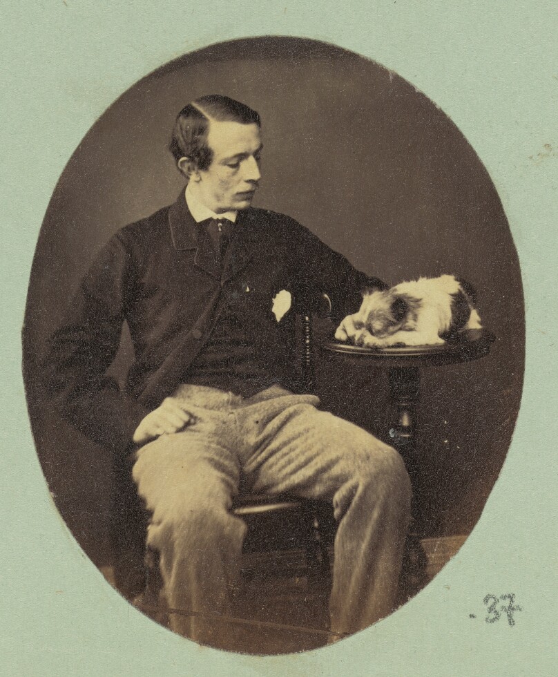 [Portrait of man and sleeping dog]