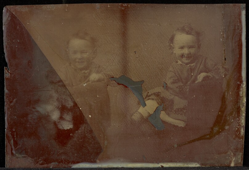 [Double portrait of a baby girl]