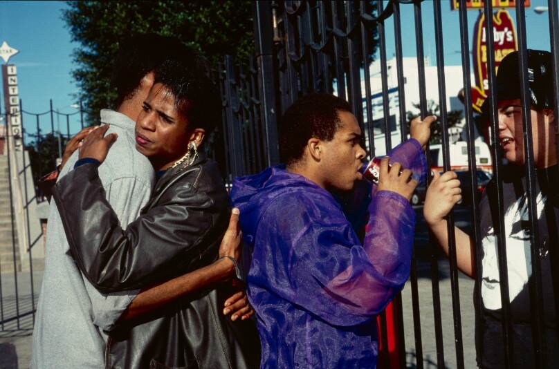 Levon, 17, hugs his friend at Hollywood High School, Hollywood