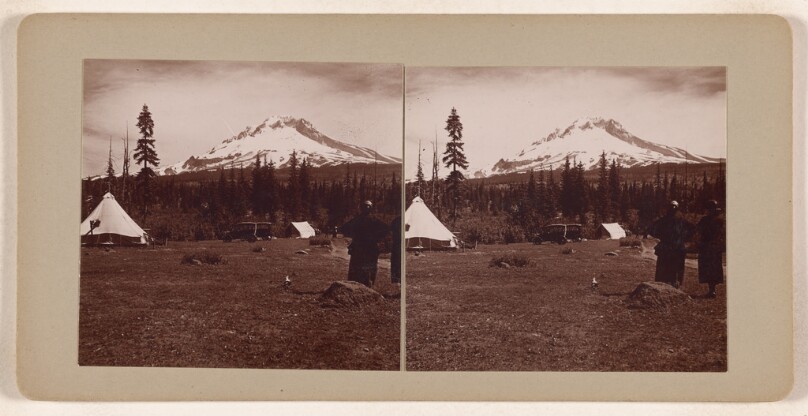[Snow covered mountain in distance of campground]
