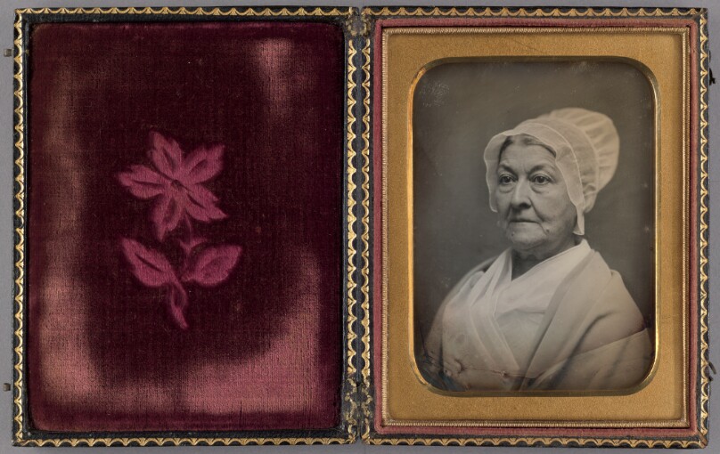 [Portrait of an elderly woman in an Amish-like bonnet]