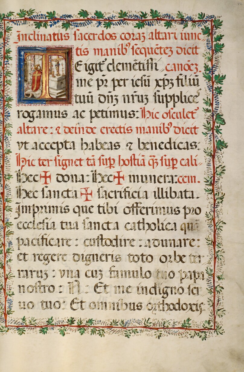 Initial T: A Priest Celebrating Mass